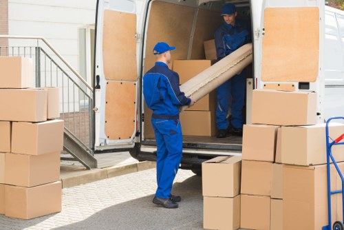 Business owners preparing desks and boxes for an office move