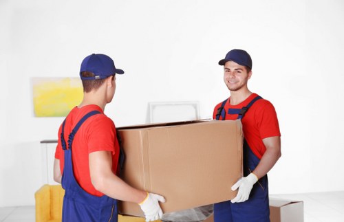 Preparing items for collection by a man with a van in Watford