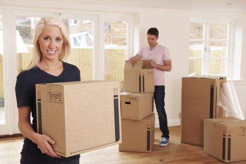 Movers loading boxes for a home move in Watford