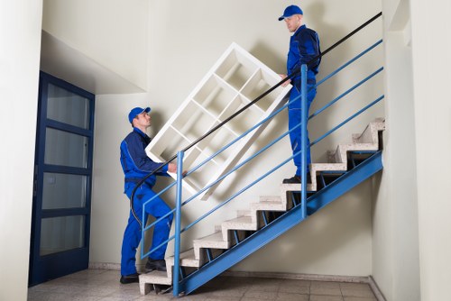 Careful handling of furniture during a man with van removal in Watford
