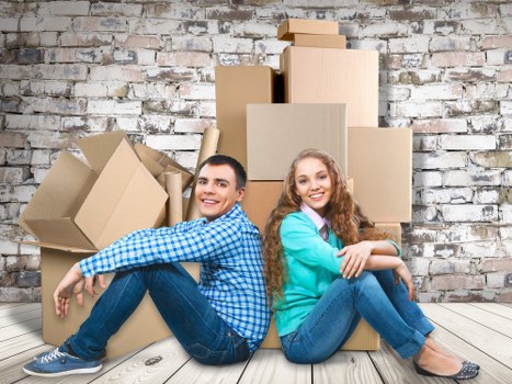 Local movers loading furniture for a Watford home relocation