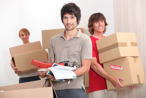 Packed office equipment ready for a business move in Watford
