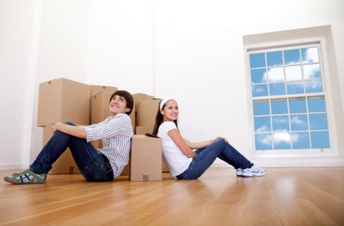 A moving van handling household items in Watford