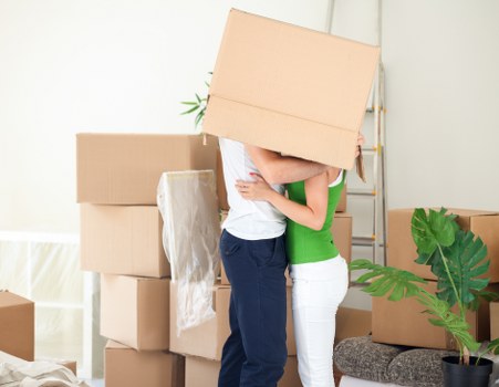Professional movers loading furniture at a Watford property